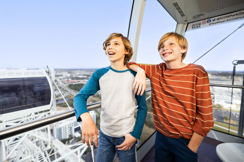Brothers and Family on The Orlando Eye with a blue sky