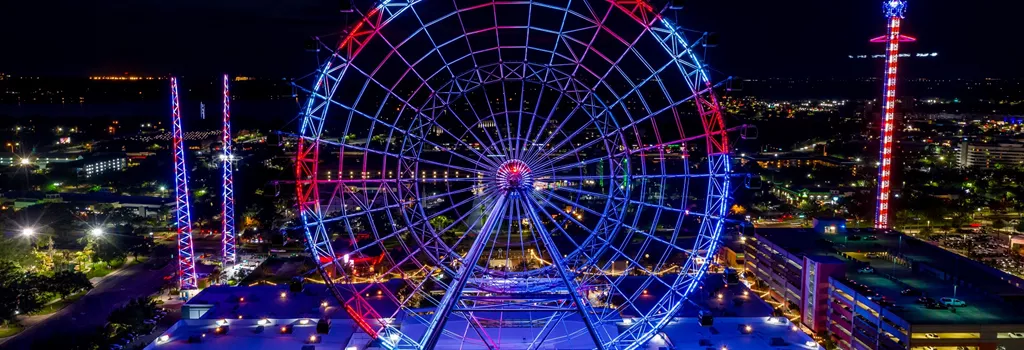 View of the entire Orlando Eye with red and blue lighting. 