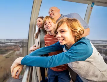 Family looking at a blue sky from The Orlando Eye